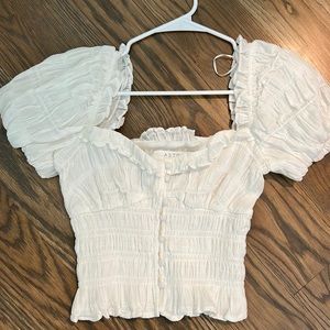 ASTR the label X revolve white top